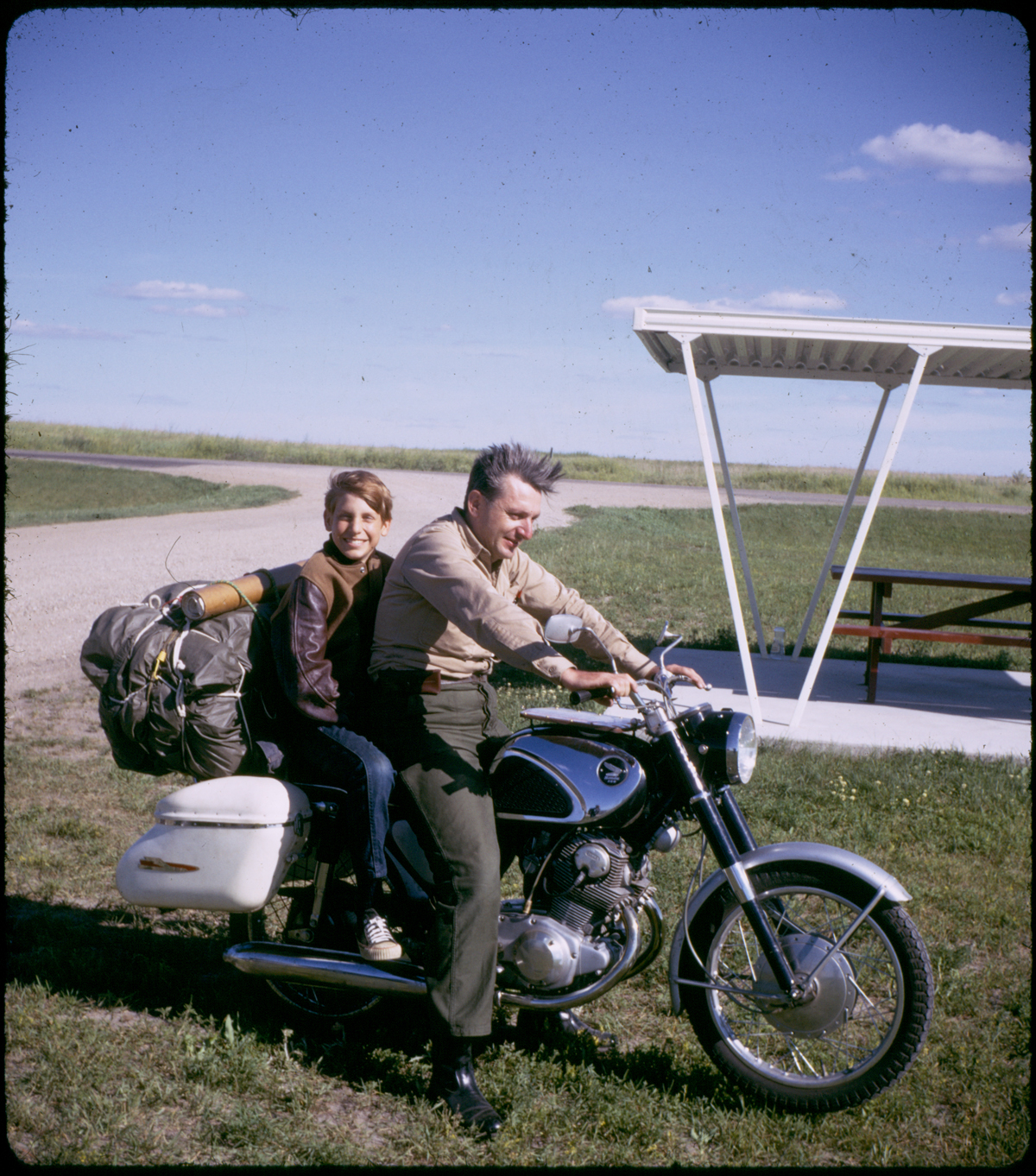 Pirzig and his son Chris on a motorcycle